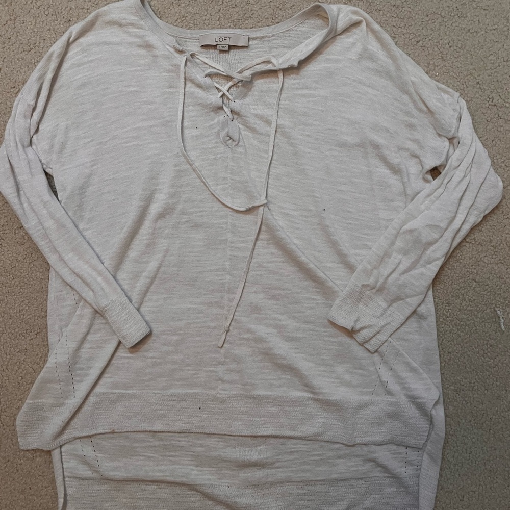 White thin knit sweater with tie on the neck